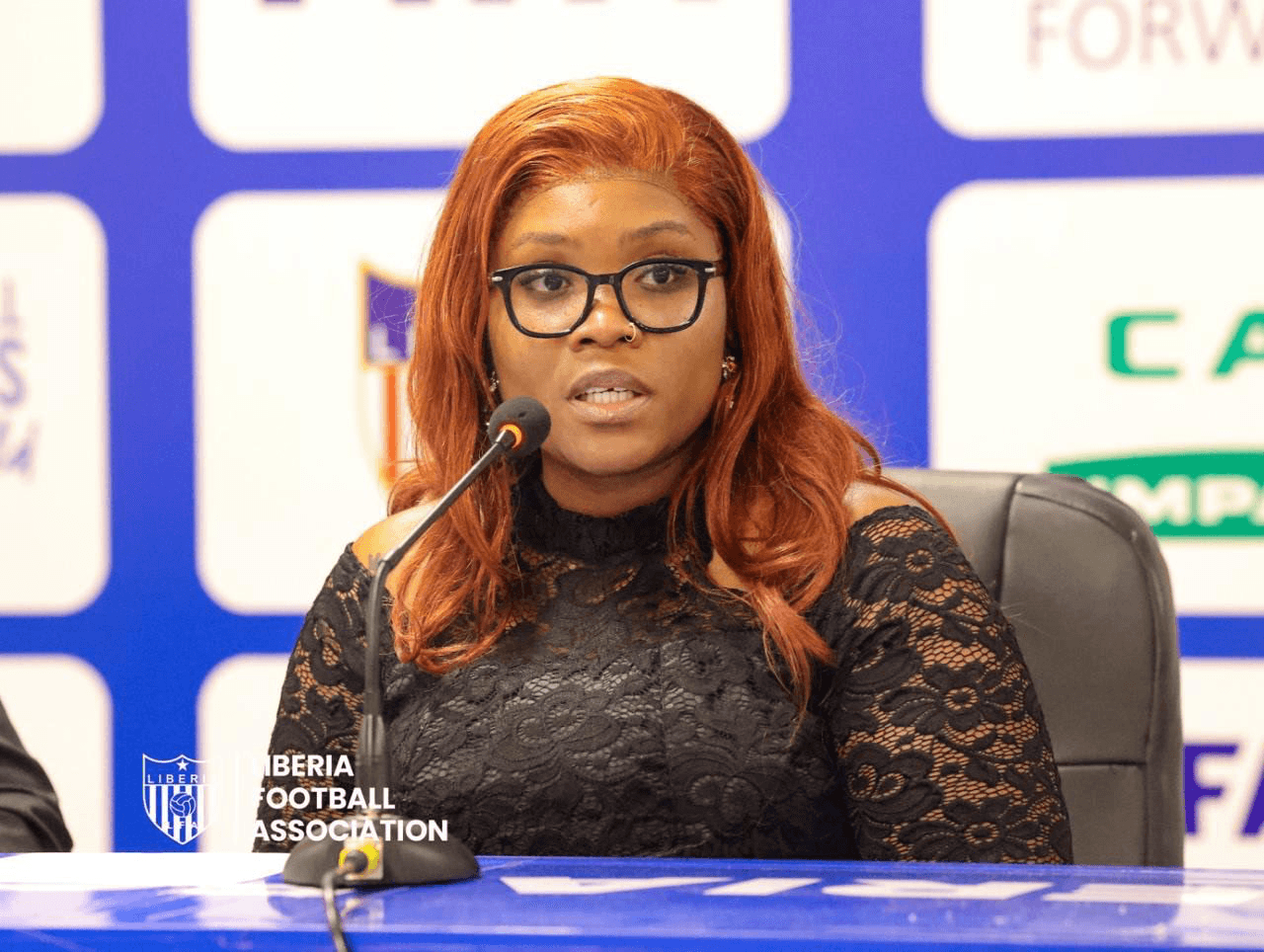 Panelist speaking into a microphone at a press briefing